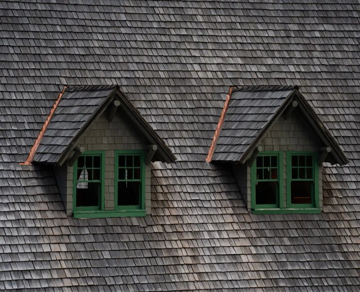 Dormers on a shingle roof in Dothan, AL, where step flashing and kickout flashing carry water past the walls